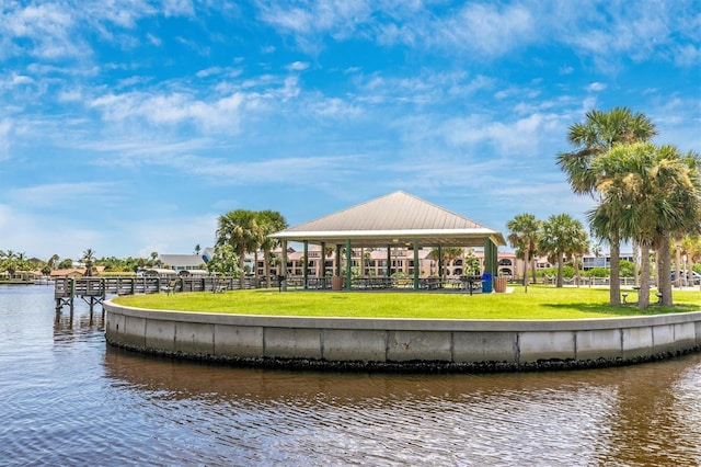 exterior space featuring a gazebo, a water view, and a yard