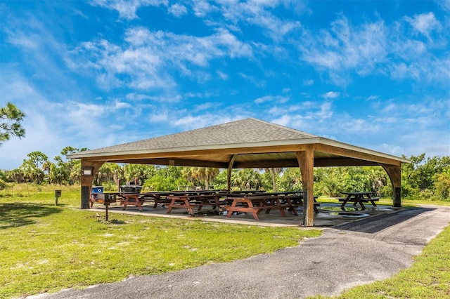 view of property's community with a gazebo and a yard