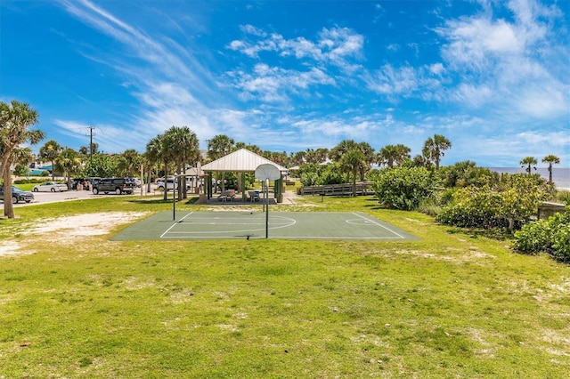 view of sport court with a yard and a gazebo