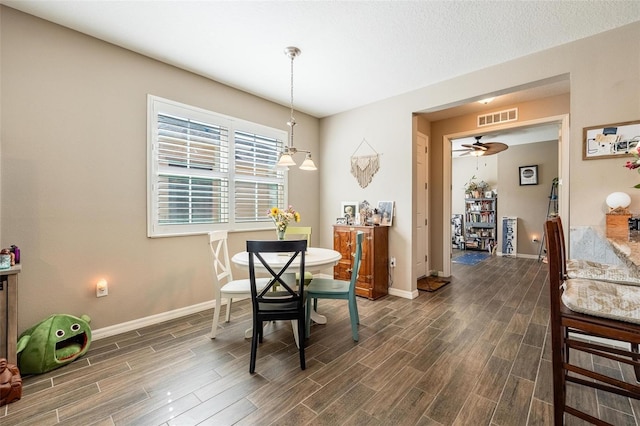 8798 Tuscany Isles Dr, Punta Gorda, FL 33950 - dining space with baseboards, visible vents, and wood finish floors