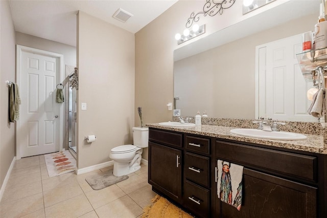 8798 Tuscany Isles Dr, Punta Gorda, FL 33950 - bathroom featuring visible vents, toilet, tile patterned flooring, and a sink