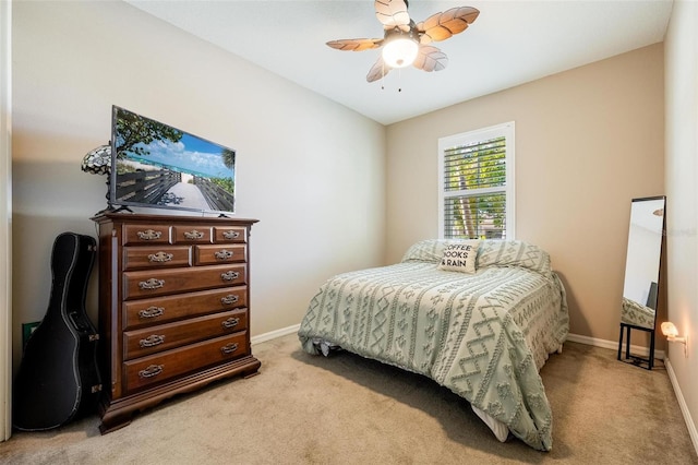 bedroom featuring ceiling fan and light colored carpet