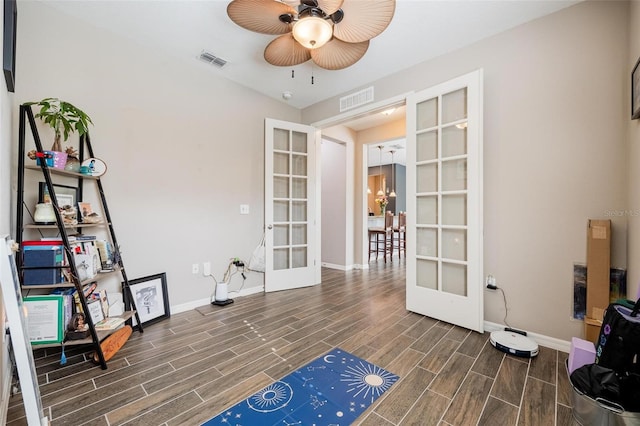 miscellaneous room with dark hardwood / wood-style flooring, ceiling fan, and french doors