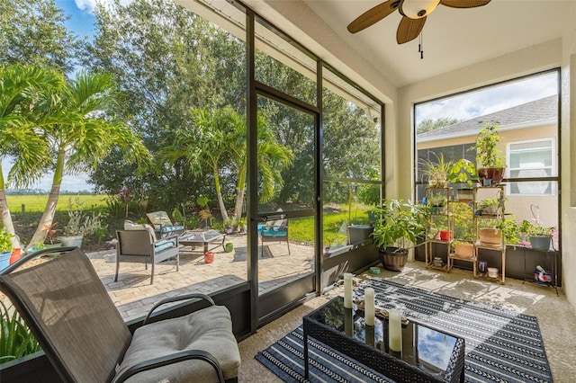 sunroom with plenty of natural light and ceiling fan