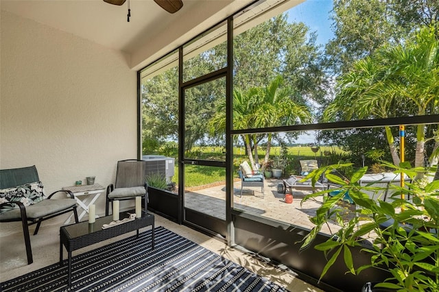 sunroom / solarium with ceiling fan