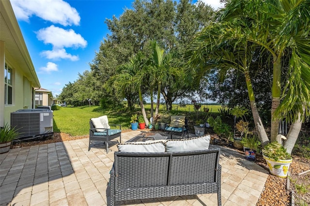 view of patio featuring cooling unit and outdoor lounge area