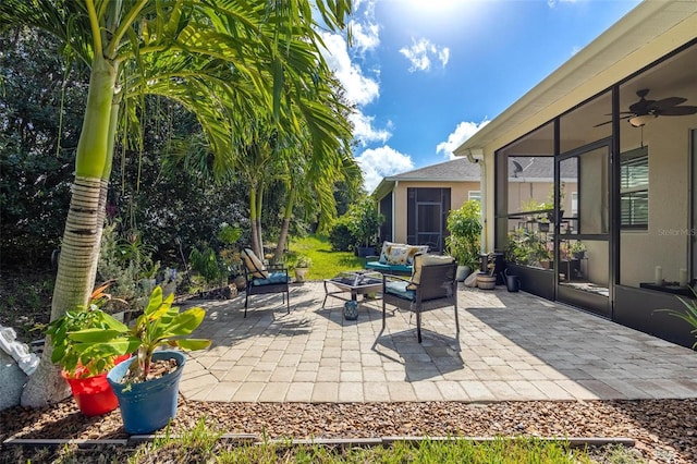 view of patio featuring an outdoor living space and ceiling fan