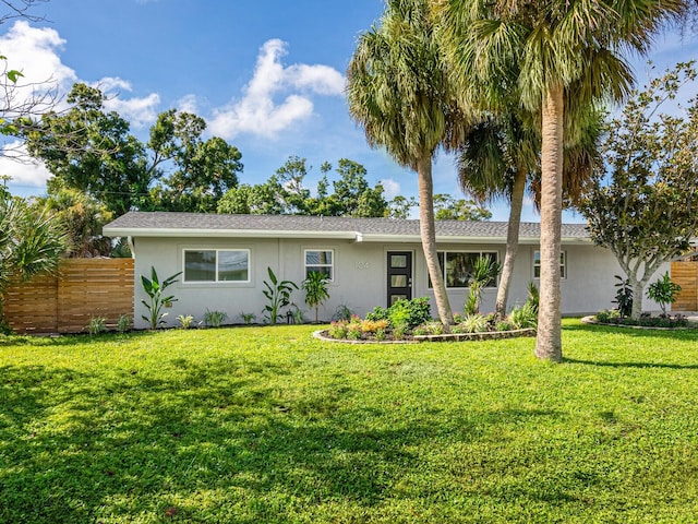 ranch-style home with a front yard