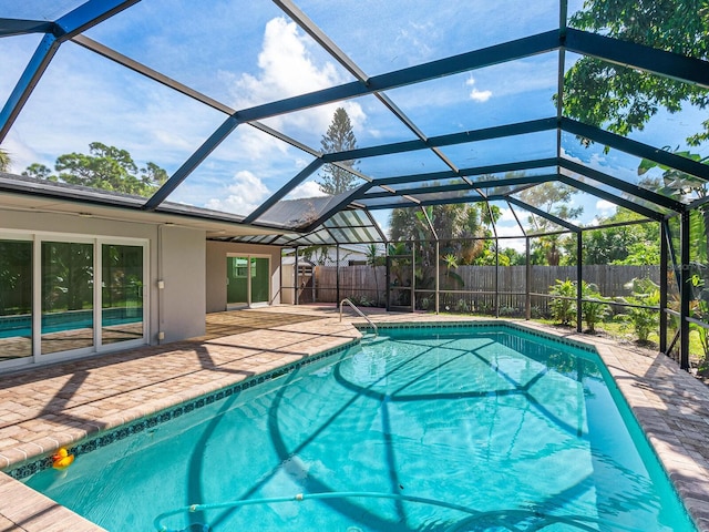 view of pool featuring a lanai and a patio