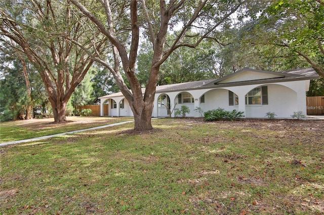 ranch-style home with a front yard