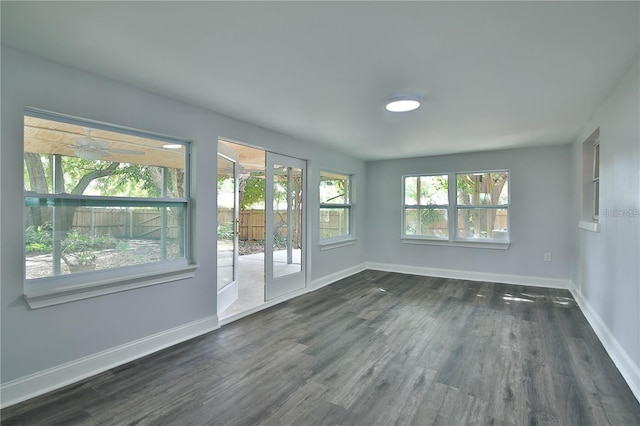 spare room with dark wood-type flooring