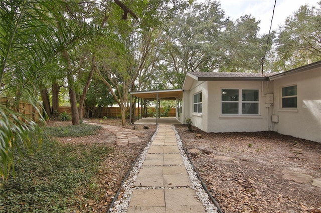 view of yard featuring a carport