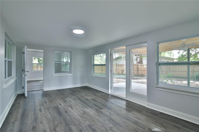 2912 Pinecrest Way, Sarasota, FL 34239 - empty room featuring dark wood finished floors and healthy amount of natural light