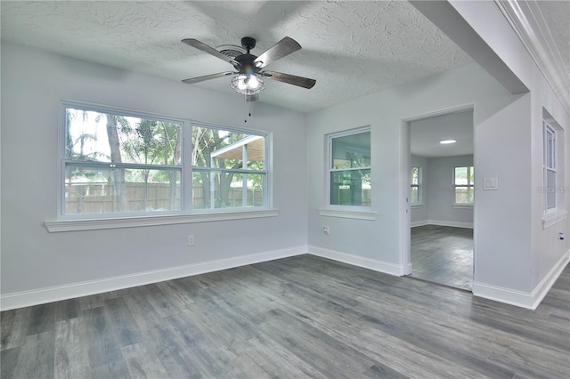 2912 Pinecrest Way, Sarasota, FL 34239 - spare room with a ceiling fan, dark wood-type flooring, and a textured ceiling