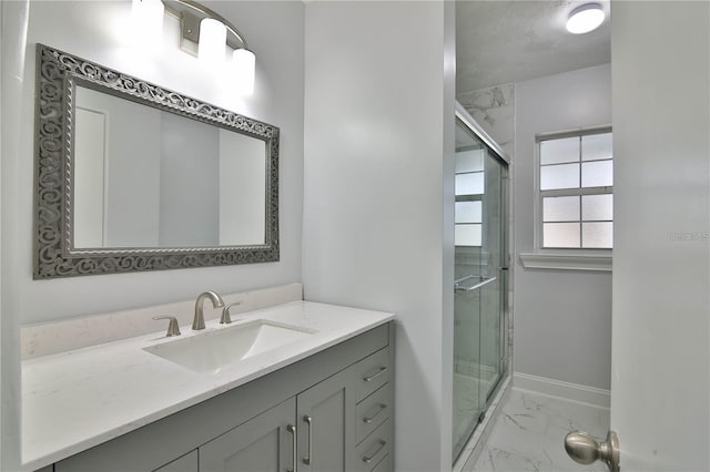 2912 Pinecrest Way, Sarasota, FL 34239 - full bath with marble look tile flooring, vanity, and a shower stall