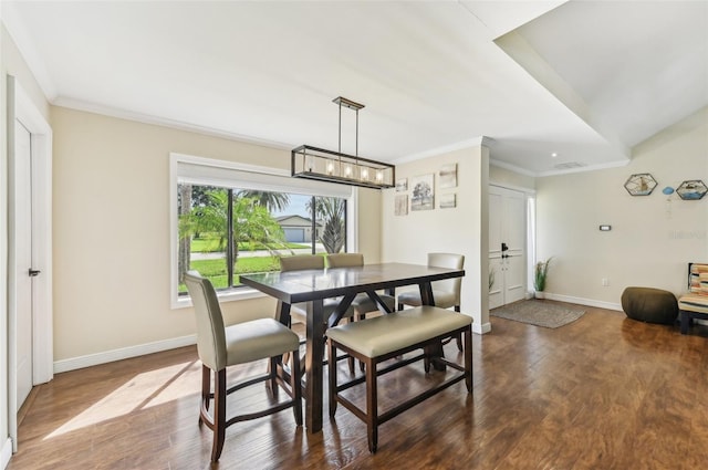 dining room with visible vents, dark wood finished floors, an inviting chandelier, crown molding, and baseboards