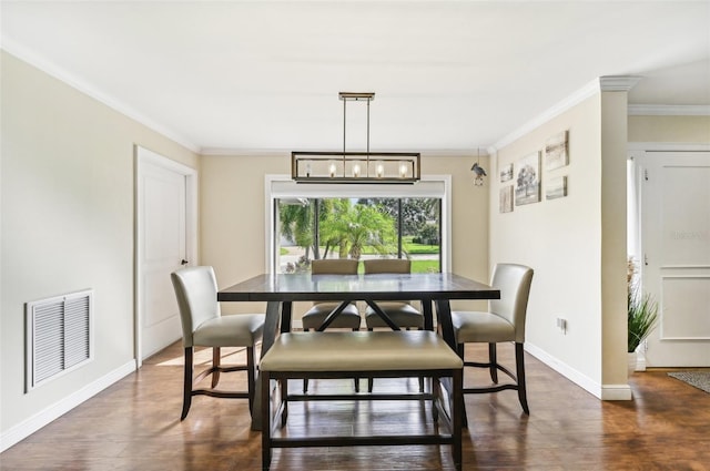 dining space featuring crown molding, baseboards, visible vents, and dark wood-style flooring