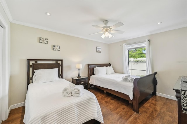 bedroom with ceiling fan, dark hardwood / wood-style floors, and crown molding