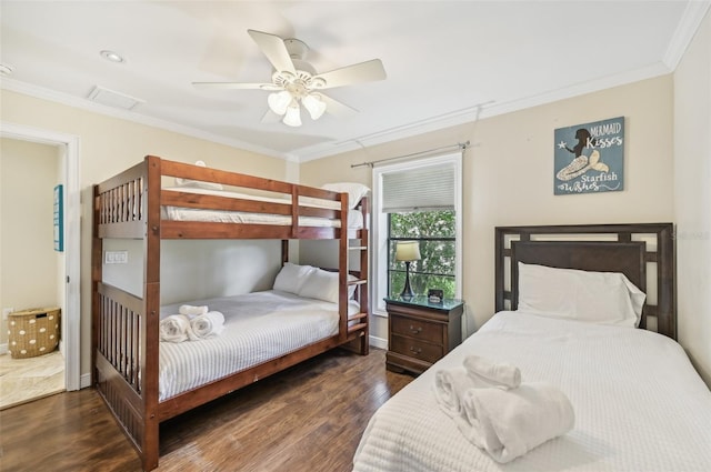 bedroom with baseboards, a ceiling fan, wood finished floors, and crown molding