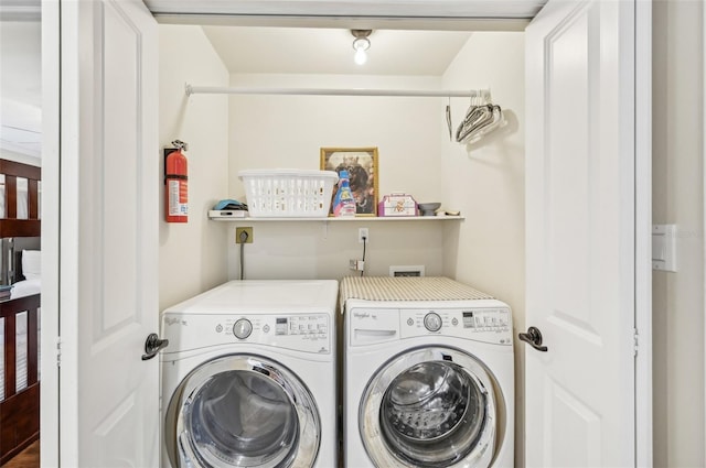 laundry area with laundry area and washer and clothes dryer