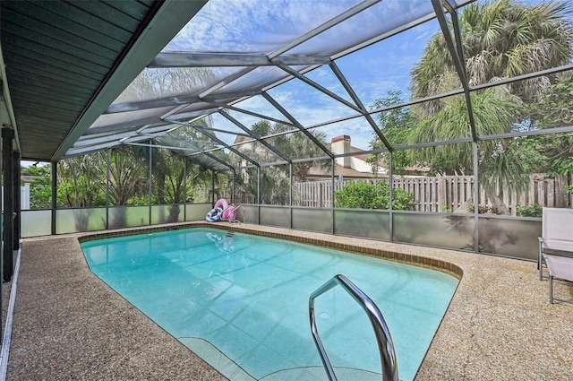 view of pool with a lanai, a fenced in pool, a patio, and fence