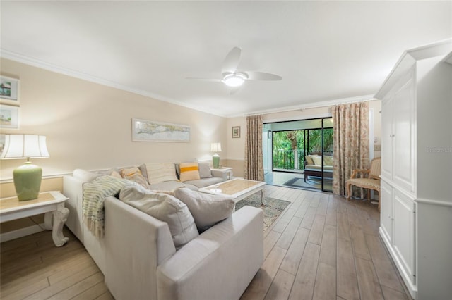 living room with ceiling fan, light hardwood / wood-style floors, and ornamental molding