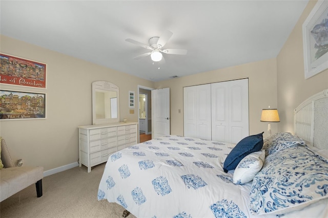 bedroom featuring a closet, ceiling fan, and light colored carpet