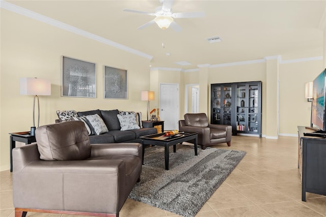 living room featuring ceiling fan, light tile patterned floors, and crown molding