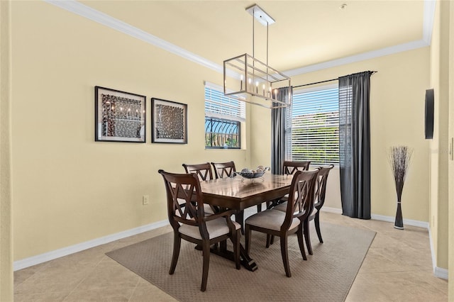 tiled dining space with a notable chandelier and ornamental molding