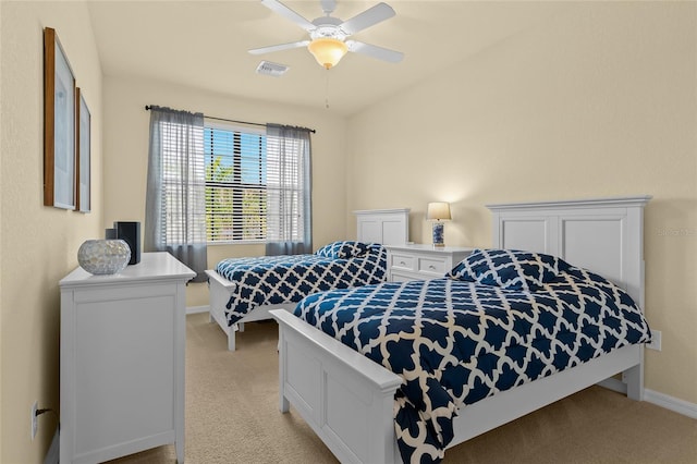 bedroom featuring ceiling fan and light colored carpet