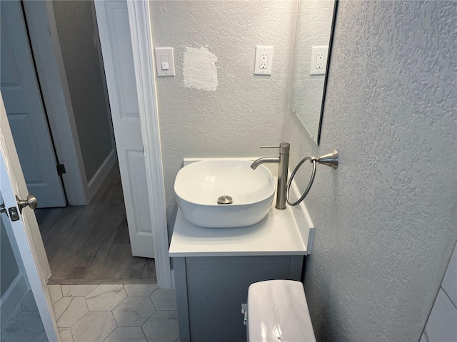 bathroom featuring wood-type flooring and vanity