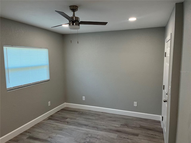 unfurnished room featuring wood-type flooring and ceiling fan