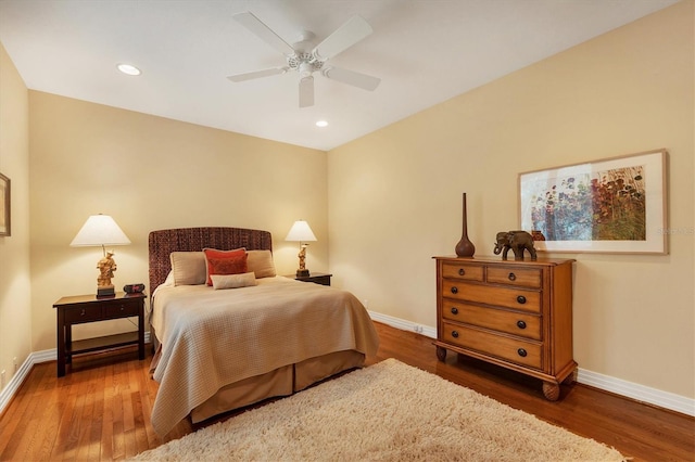 bedroom featuring ceiling fan and dark hardwood / wood-style floors