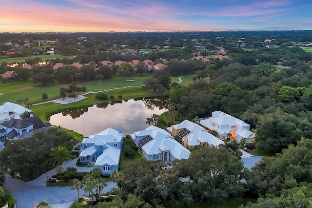 aerial view at dusk with a water view