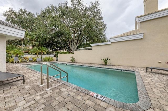 view of pool featuring a patio area