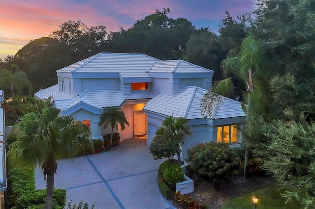 view of front of property featuring driveway and stucco siding