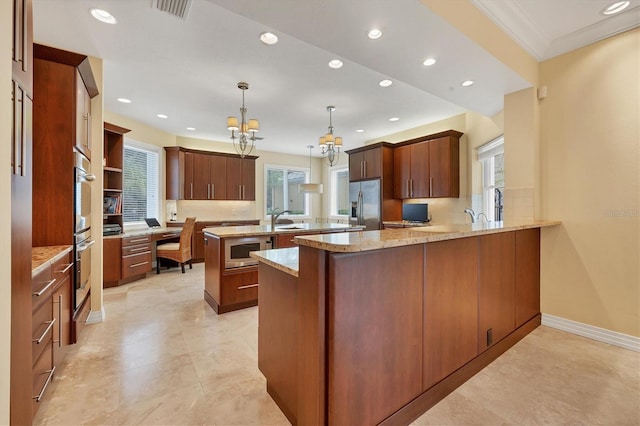 kitchen with decorative light fixtures, stainless steel appliances, recessed lighting, visible vents, and a peninsula