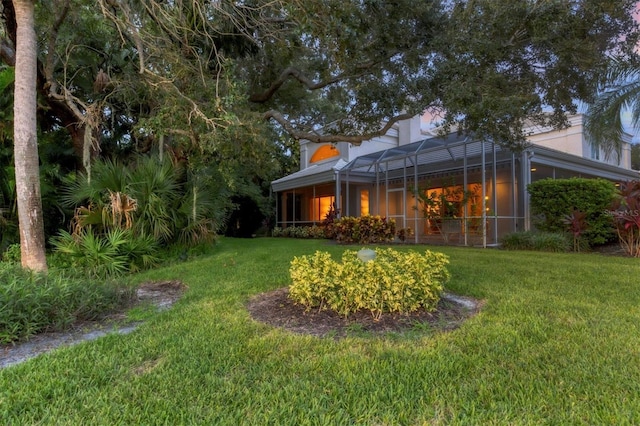 view of yard featuring a lanai