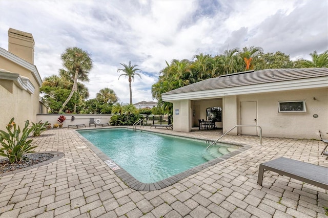 view of pool featuring a fenced in pool, a patio, and fence