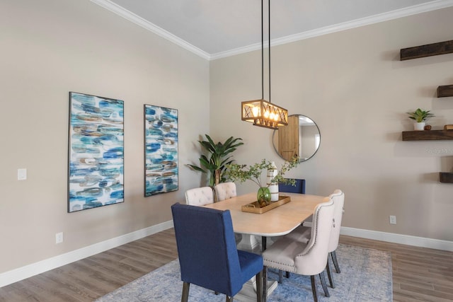 dining room featuring ornamental molding and wood-type flooring