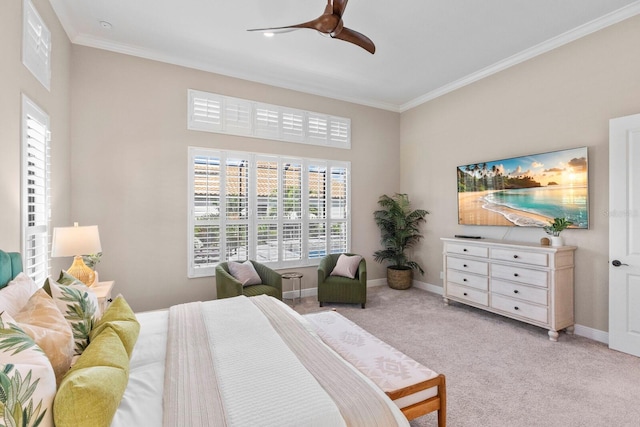 carpeted bedroom with ceiling fan and crown molding