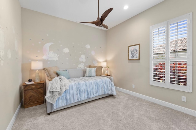 carpeted bedroom featuring ceiling fan