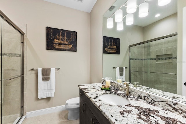 bathroom with walk in shower, tile patterned flooring, vanity, and toilet