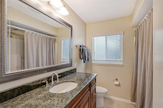 1833 Sandalwood Dr, Sarasota, FL 34231 - full bath with tile patterned floors, toilet, vanity, baseboards, and a shower with shower curtain