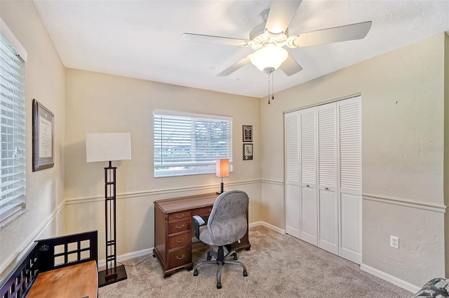 office area with light colored carpet and ceiling fan