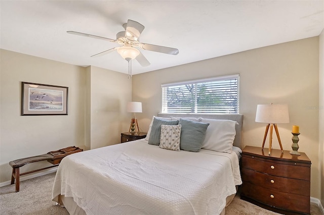 bedroom featuring ceiling fan and light carpet