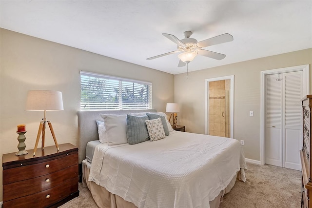 1833 Sandalwood Dr, Sarasota, FL 34231 - bedroom featuring light colored carpet, a ceiling fan, baseboards, and ensuite bathroom