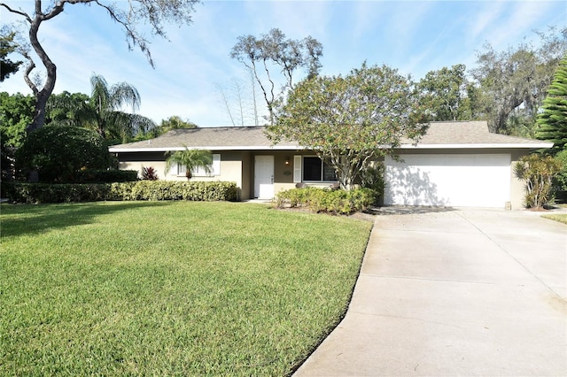 1833 Sandalwood Dr, Sarasota, FL 34231 - single story home featuring a garage, stucco siding, concrete driveway, and a front lawn