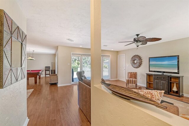 1833 Sandalwood Dr, Sarasota, FL 34231 - living room featuring wood finished floors, billiards table, baseboards, and a ceiling fan