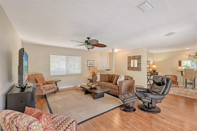 1833 Sandalwood Dr, Sarasota, FL 34231 - living room with wood finished floors, ceiling fan, and baseboards